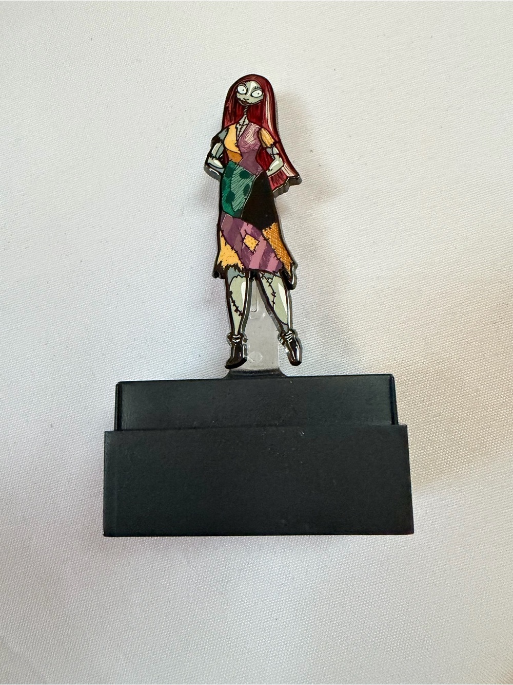 Figpin’s Sally from Nightmare Before Christmas series. Missing case.